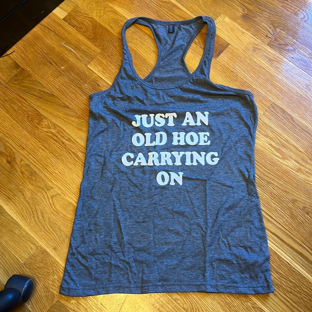 Gray size medium just an old hoe carrying on tank. Never worn
